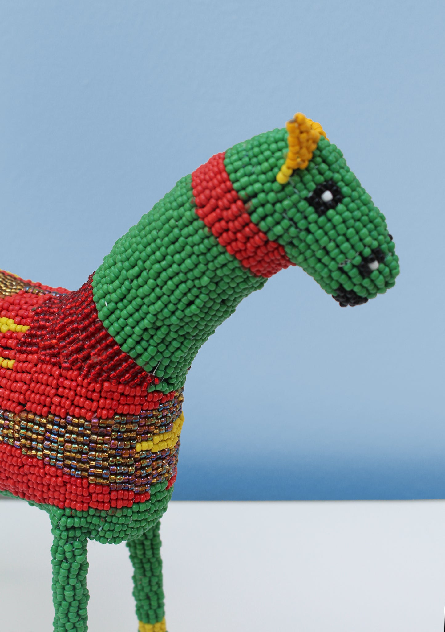Multi-coloured beaded horse