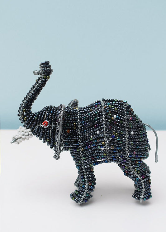 Beaded elephant with trunk up