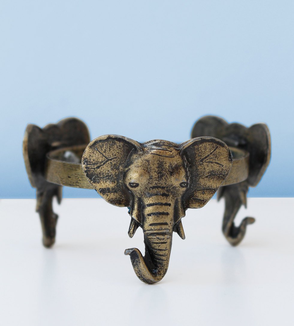 Elephant head brass stand