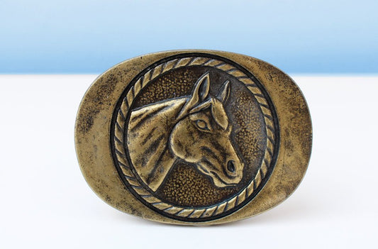 Brass horse belt buckle