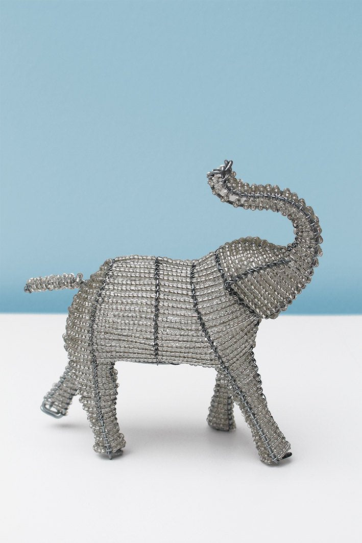 Trunk-raised beaded elephant