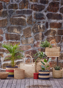 Multicoloured grass-woven African basket