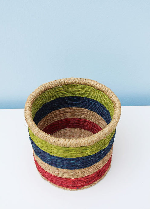 Multicoloured grass-woven African basket